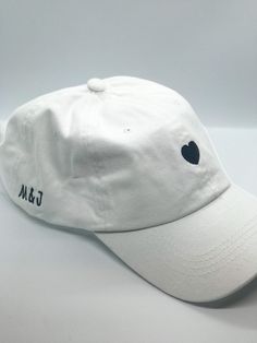 White or black, adjustable baseball cap perfect for an engagement gift, a bridal shower, or bachelorette party. Customizable first name initials on the side of the cap. Use promo code SAVEHATS to save 10% on 5 or more hats! Please note- all custom hats require at MOST 14 days to process, as each hat is made to order. This does not include shipping time. Based on the volume of orders at the time, this processing time may be shortened! If you are working on a timeline, be sure to message me so we Wedding Baseball Hat, Bach Gifts, Bach Gift, White Baseball Hat, Custom Baseball Hats, Bachelorette Hats, Bff Gifts Diy, Bf Gifts, Personalized Hats