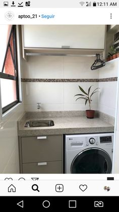 a small kitchen with a washer and dryer