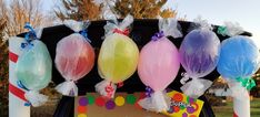 balloons are tied to the back of a car