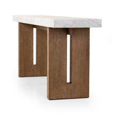 a white marble top and wooden legs on a wood frame table with two square holes in the center