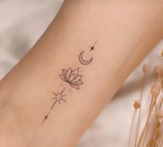 a woman's foot with a tattoo on it and a flower in the middle