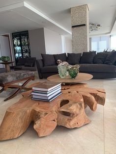 a living room filled with furniture and a wooden table