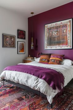 Discover 14 minimalist, colorful boho bedroom decor ideas. Transform your space with vibrant accents, simple designs, layered textiles, and natural elements. Embrace a blend of minimalism and boho charm for a cozy, stylish retreat that reflects your unique taste. Magenta Boho Bedroom, Red Purple Room, Cozy Bedroom Purple, Plum Accent Wall Bedroom, Red And Purple Bedroom, Magenta Bedroom Ideas, Magenta Bedrooms, Purple Wall Bedroom, Zen Apartment