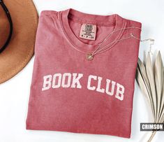 Product: Book Club Comfort Colors T-Shirt, Reading Team Shirt, Book Club Tee, Reading Teacher Gift, Librarian Gift, Gift For Readers, Book Lover Gift ✦ MAKE IT PERFECT and Customize this shirt for FREE! Just shoot us a message BEFORE purchasing and we will work with you to create a design you'll love. ✦ SIZING CHART Please refer to the sizing chart in the pictures above to find your perfect fit! Simply lay your favorite T-shirt flat and measure armpit to armpit then compare it to the size chart Book Club Shirt Ideas, Belles Book Club Shirt, Reading Teacher Gifts, Reading Tshirt, Literary Relaxed Fit Crew Neck T-shirt, Relaxed Fit Pre-shrunk Bookish T-shirt, Book Club Shirt, Gifts For Librarians, Reading Teacher