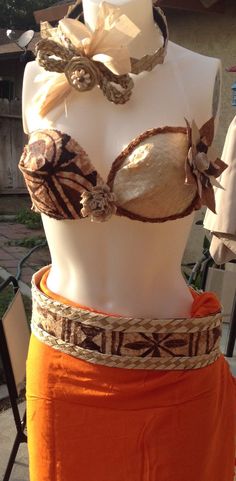 This is a sample of what we can make for you. NOTE- All costumes are made to order! This listing is for the bra only! This bra is made of tapa cloth, coconut fibers and weaved white lauhala. The flower in the middle is white tapa cloth, on the side of the bra the flower is tapa cloth and coconut bark. This listing is for children, and for teens and adult cups A-C, D, DD All cups are a different price! If you purchase this listing and provide me a size smaller than your cup I will not start your Coconut Bark, Philippines Outfit, Tahitian Costumes, Tapa Cloth, Girls Costumes, Exotic Jewelry, Competition Costumes, Island Fashion, Hawaiian Outfit