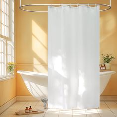 a white shower curtain in a bathroom next to a bathtub and window with potted plants on the floor