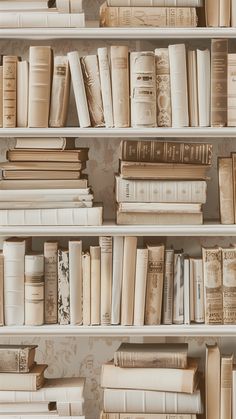 several rows of books on shelves in a room