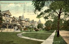 an old postcard shows houses on the street in front of trees and lawns