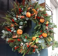 Traditional Xmas wreath all fresh foliage dried fruits and cone pine aromatic cinnamon sticks Dried Fruit Wreath, Christmas Reef Ideas, Fruit Wreaths, Christmas Reef, Fruit Wreath, Floral Door Wreaths, Colonial Christmas, Xmas Wreaths, Wreath Making