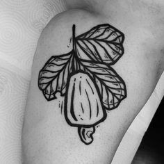 a black and white photo of a leaf tattoo