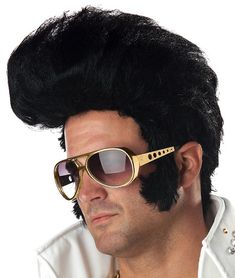 a man with black hair and sunglasses on his head