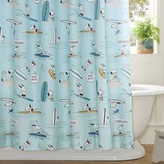 a blue shower curtain with cartoon characters on it