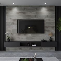 a living room with a large flat screen tv mounted on the side of it's wall