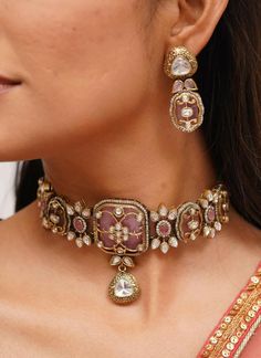 Pretty fine Victorian Kundan choker with pink/Red colored stones and Kundan and Zirconia Necklace with matching earrings The Necklace has adjustable Dori.  The Earrings Have Pushbacks  Highest quality and craftsmanship. Arrives in a box Please let me know if you have any questions Customized orders takes 3 to 4 weeks, depending on piece requirements.  The Ombre Designs Jewelry pieces can be customized in accordance with your requirement.  Please Email or Whats app on : +91 8448833193 / sonalikamehra@theombredesigns.com Pink Choker Necklace Indian, Pink Kundan Jewelry With Intricate Design, Pink Kundan Necklace With Intricate Design, Pink Intricate Jewelry For Diwali, Festive Pink Jewelry With Intricate Design, Festive Stone Work Choker For Reception, Kundan Jeweled Choker For Wedding, Pink Kundan Necklace For Reception In Temple Jewelry Style, Ceremonial Pink Kundan Jewelry