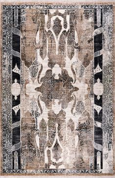 an antique rug with black and white designs