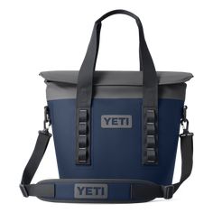 the yeti cooler bag is shown in blue and grey with an adjustable shoulder strap