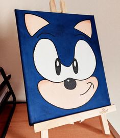 a painting of a blue sonic the hedgehog on an easel