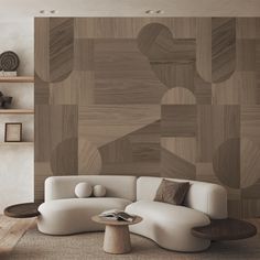 a modern living room with white furniture and wood paneling on the wall behind it