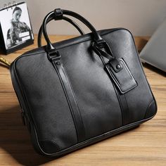 Usage: laptop document men bag Type: leather Briefcases Style: Business Size: 14 inches Pattern Type: Solid Number of Handles/Straps: Single Material Composition: polyester Main Material: PU Lining Material: Polyester Item Width: 7cm Item Weight: 1.1kg Item Type: Briefcases Item Length: 40cm Item Height: 30cm Handle/Strap Type: Soft Handle Gender: MEN Exterior: Silt Pocket Closure Type: zipper Modern Black Bags For Business Meetings, Black Leather Bags For Business Meetings, Modern Black Business Bags, Leather Laptop Shoulder Bag For Business Trips, Black Leather Satchel Briefcase, Large Capacity Black Briefcase For Business, Black Rectangular Bag For Business Meetings, Black Rectangular Bag For Business, Black Laptop Bag With Zipper For Business Trips