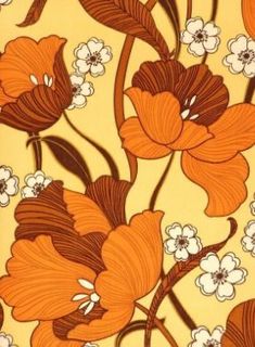 an orange and white flower pattern on a yellow background