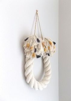 a white rope hanging on the wall