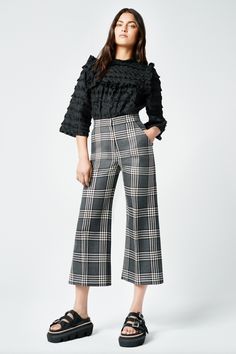 WIDE LEG CULOTTE | PS2412, PF24039 Details: High-rise with a cropped culotte length, this pant is fitted through the waist, hips, and thigh, and features a flattering A-line leg silhouette. Color: Charcoal Plaid Size: Model wears a size 25 jean and is wearing size 0 featuring a 23" inseam. Please use the Size Guide to determine your size. Content + Care: 100% Wool. Lining: 100% Cupro Rayon that is ecotoxicity-free and entirely biodegradable. Dry Clean Only. Made in Canada Pair this culotte with Jumpsuit Skirt, Shopping Event, Blazer Dress, Sweater Skirt, Outerwear Jackets, Denim Dress, Style Guides, Denim Skirt, Blazer Jacket