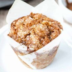 a muffin sitting on top of a white plate