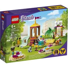 a box with the contents of a lego friends set in it's display case