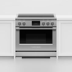 an oven built into the side of a white kitchen countertop with drawers on both sides