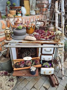 an old stove with many pots and pans on it