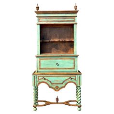 an old fashioned blue cabinet with drawers on the top and bottom, painted in green