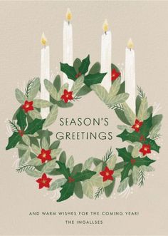 a card with candles and holly wreaths on it, says season's greetings