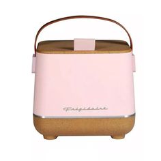 a pink toaster sitting on top of a counter