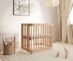 a baby's room with a crib and toys on the floor in front of it