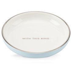 a white and blue bowl with the words, with this ring on it's side