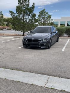 a black car parked in a parking lot