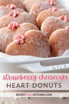 strawberry cheesecake heart donuts in a white dish with pink sprinkles