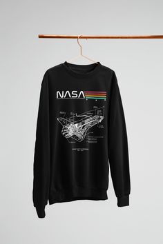 an nasa sweatshirt hanging on a clothesline with the space shuttle diagram printed on it