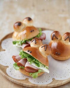 small sandwiches with ham and cheese on buns