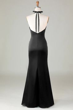 the back of a black evening gown on display