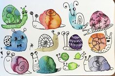 an art project with watercolors on paper depicting snails and snails in different colors