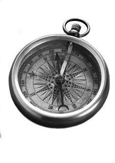 black and white photograph of an old compass