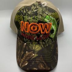 a mossy hat with the word now written in orange and green letters on it