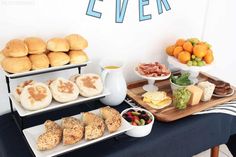 an assortment of breads and pastries are displayed on a table