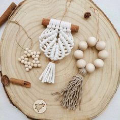 an assortment of bead and tassels on a wooden board