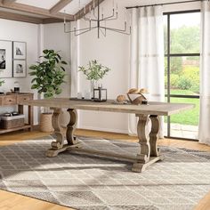 a large wooden table sitting on top of a rug in a living room next to a window