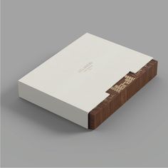 a white box with wood trim on top