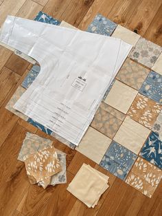 several pieces of fabric laid out on the floor