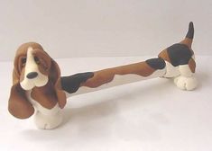 a brown and white dog figurine sitting on top of a table