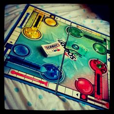 a close up of a board game on a bed